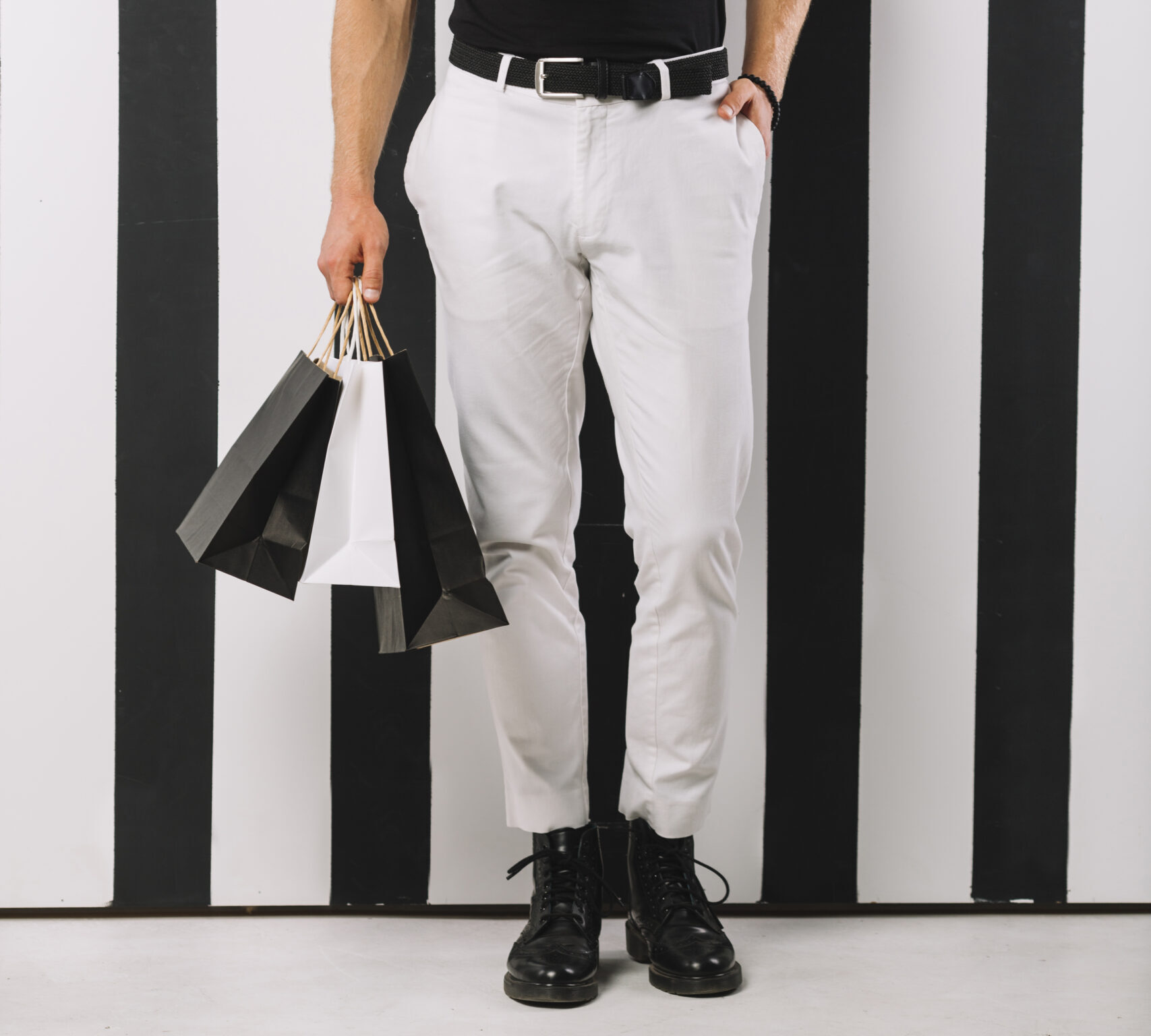 handsome-adult-man-holding-shopping-bags